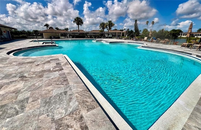 view of swimming pool featuring a patio area