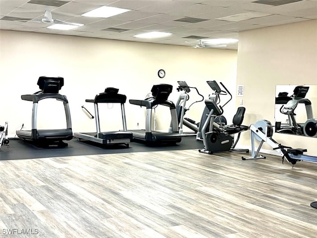 workout area featuring a drop ceiling and ceiling fan