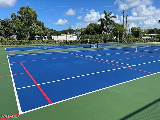 view of tennis court featuring basketball court