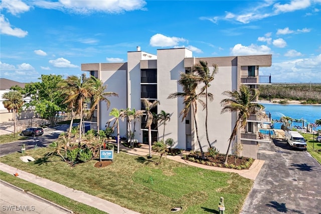 view of property with a water view