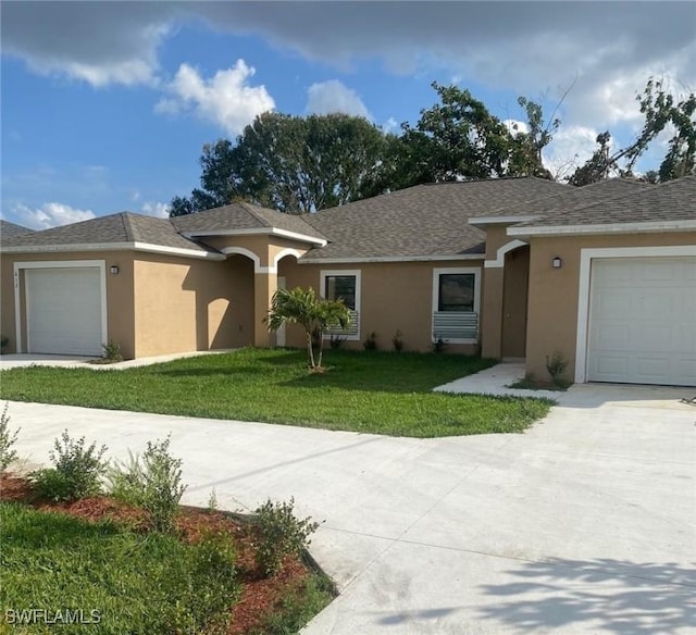 ranch-style home with a front yard and a garage