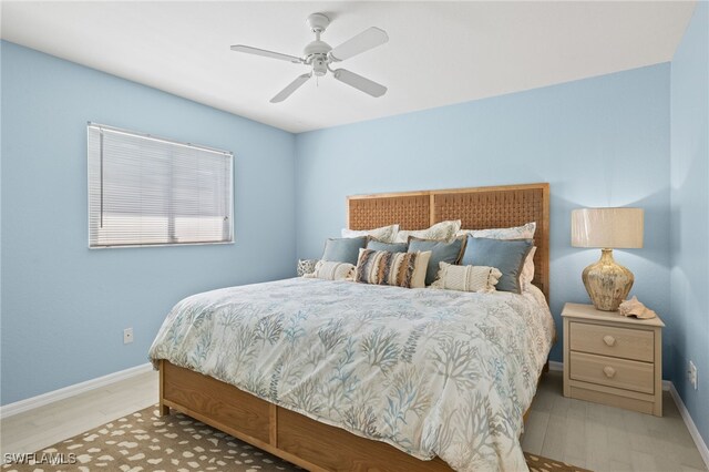 bedroom featuring light wood-type flooring and ceiling fan