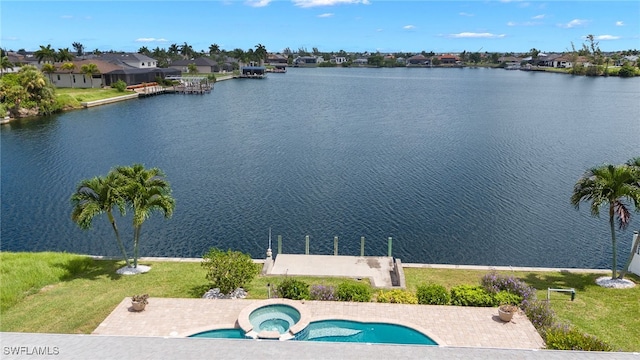 birds eye view of property featuring a water view