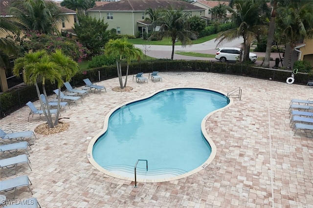 view of swimming pool with a patio