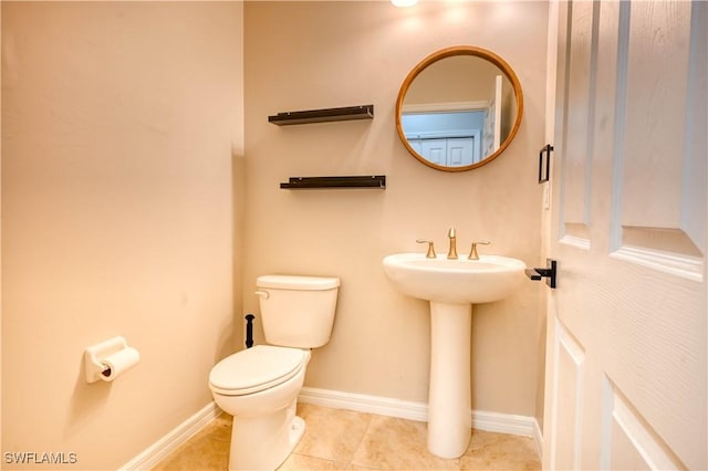 bathroom featuring tile patterned floors and toilet