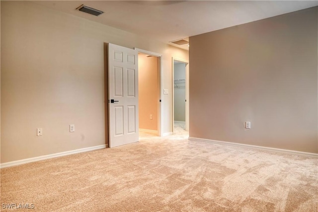 empty room featuring light colored carpet