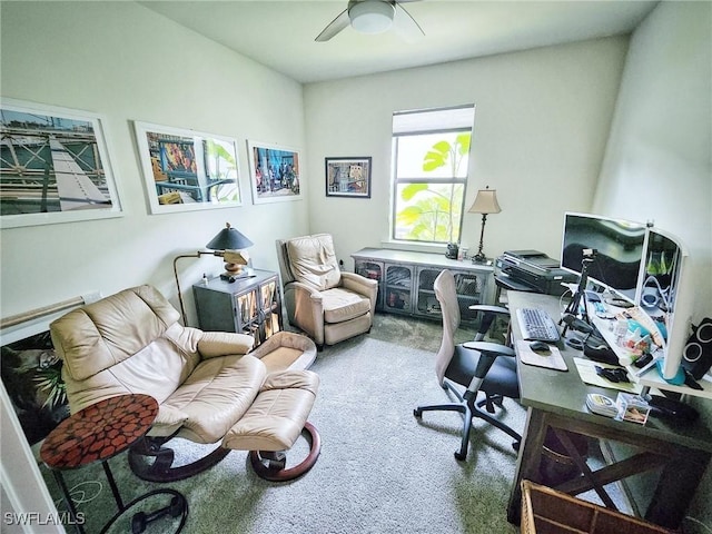 carpeted office featuring ceiling fan