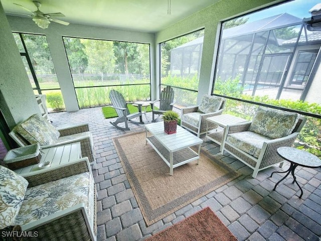 sunroom / solarium with ceiling fan