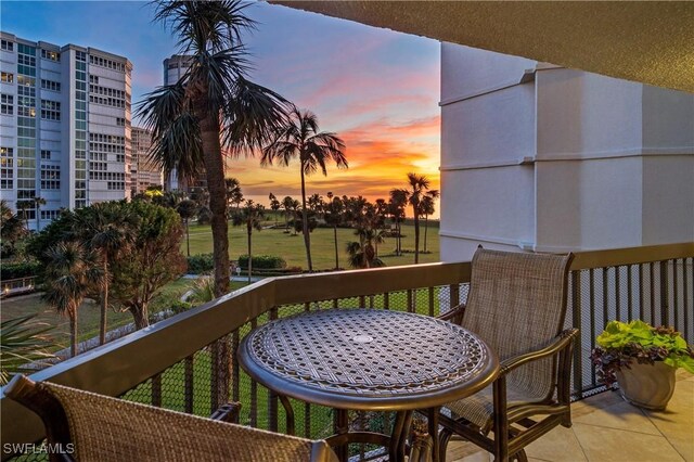 view of balcony at dusk