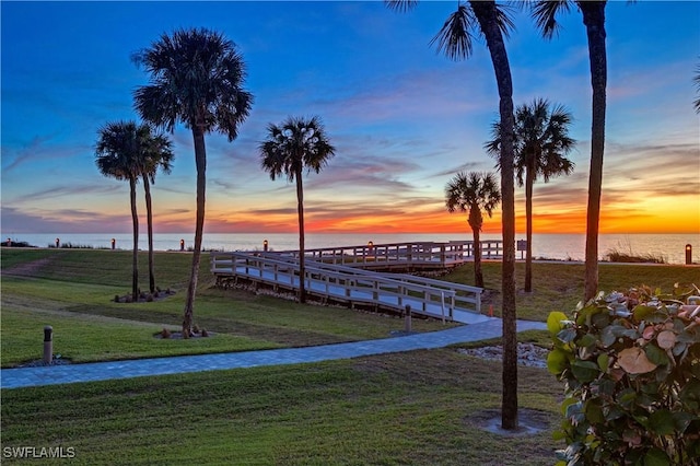 yard at dusk with a water view