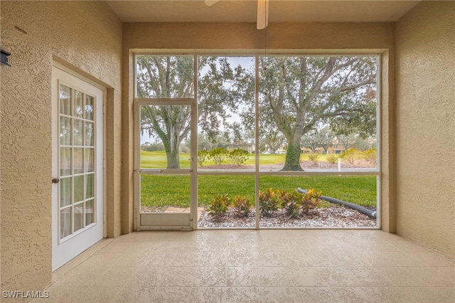 unfurnished sunroom featuring a wealth of natural light