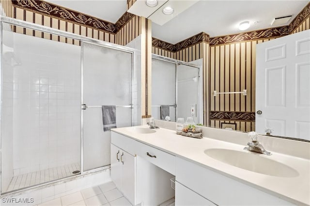 bathroom with vanity, tile patterned flooring, and a shower with shower door