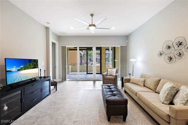 tiled living room with ceiling fan and french doors