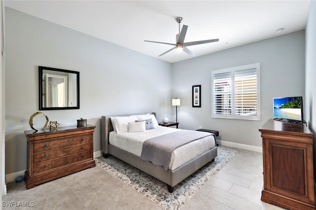 tiled bedroom with ceiling fan