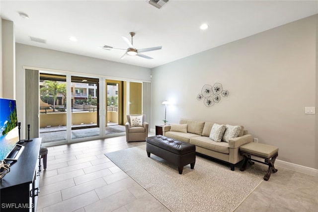 tiled living room featuring ceiling fan