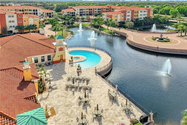 view of pool with a water view