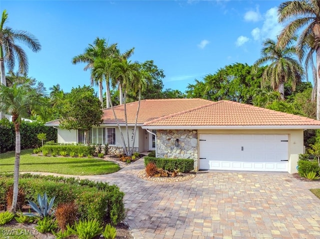 ranch-style home featuring a garage