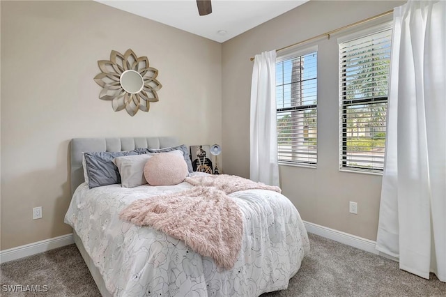 carpeted bedroom featuring ceiling fan