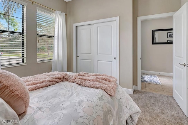 carpeted bedroom with a closet