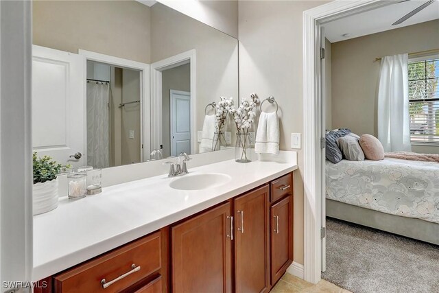 bathroom featuring ceiling fan and vanity