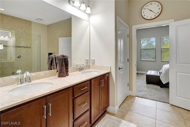 bathroom featuring a shower, tile patterned floors, and vanity