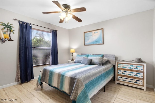 bedroom with ceiling fan and light tile patterned floors