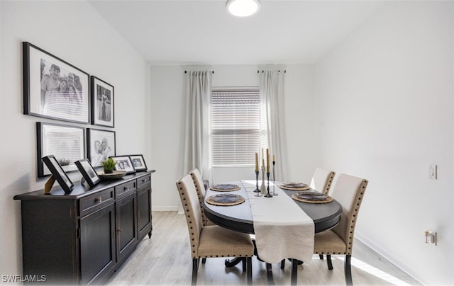 dining area featuring light wood-type flooring