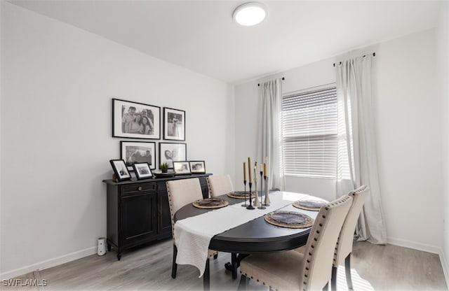 dining area with light hardwood / wood-style flooring