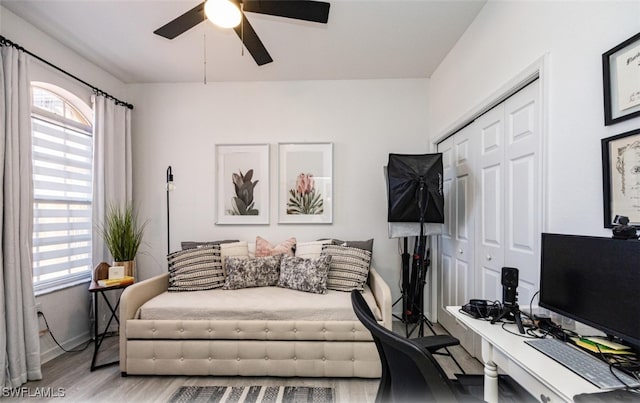 interior space with ceiling fan and light wood-type flooring