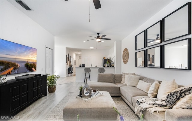 living area with light wood-style flooring, visible vents, a ceiling fan, and recessed lighting