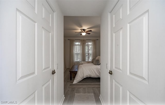 bedroom featuring hardwood / wood-style flooring and ceiling fan