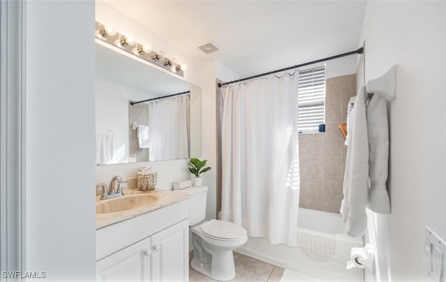 full bathroom featuring tile patterned flooring, shower / tub combo, vanity, and toilet