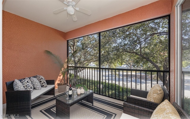 sunroom / solarium with plenty of natural light and ceiling fan