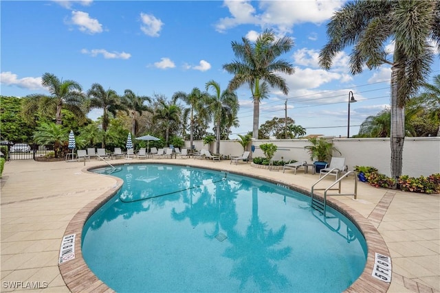 view of swimming pool featuring a patio area