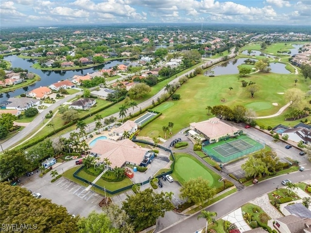 bird's eye view featuring view of golf course, a water view, and a residential view