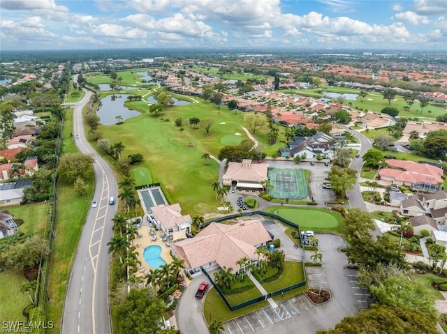 aerial view featuring a residential view, view of golf course, and a water view