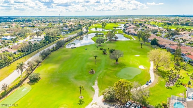 aerial view featuring view of golf course and a water view