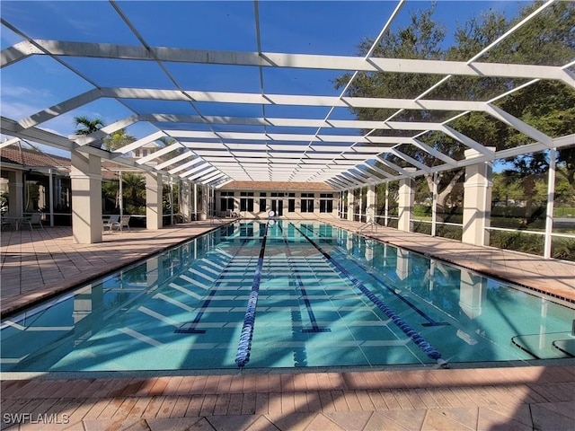 view of pool featuring a lanai and a patio area