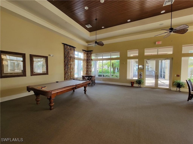 recreation room featuring a towering ceiling, pool table, ceiling fan, and carpet flooring