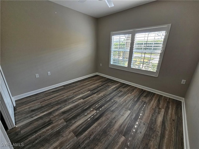 unfurnished room with dark hardwood / wood-style flooring and ceiling fan