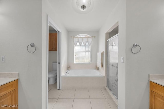 full bathroom featuring tile patterned floors, vanity, toilet, and separate shower and tub