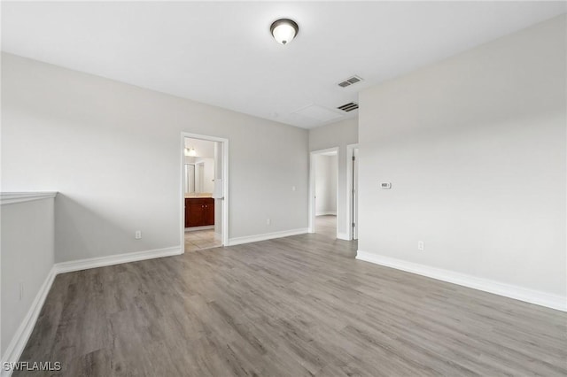 unfurnished room with light hardwood / wood-style flooring