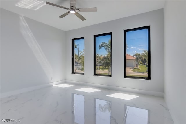 empty room featuring ceiling fan