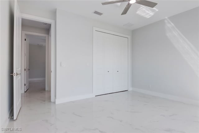 unfurnished bedroom with a closet and ceiling fan