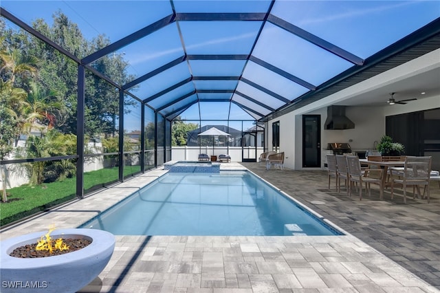 view of swimming pool featuring a lanai, area for grilling, ceiling fan, and a patio