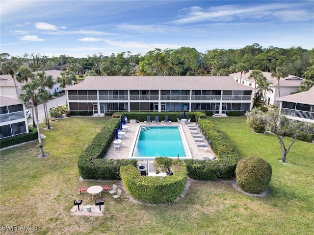 view of pool with a yard and cooling unit