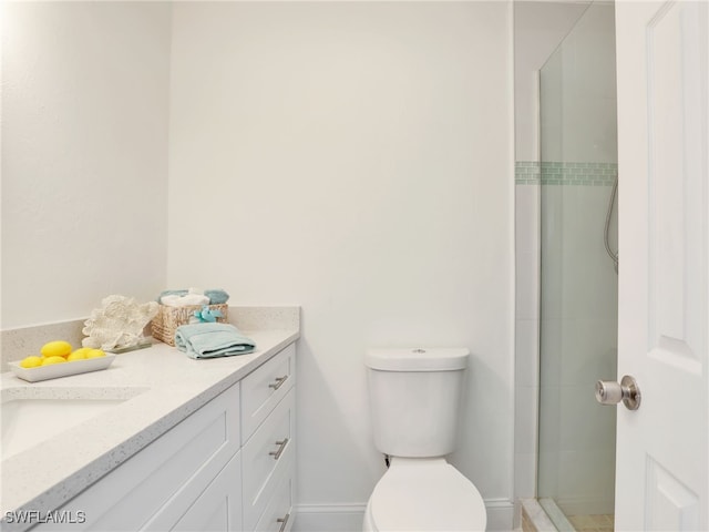 bathroom with vanity, toilet, and walk in shower