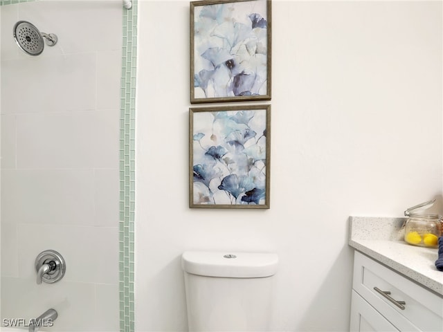 full bathroom with vanity, toilet, and tiled shower / bath combo