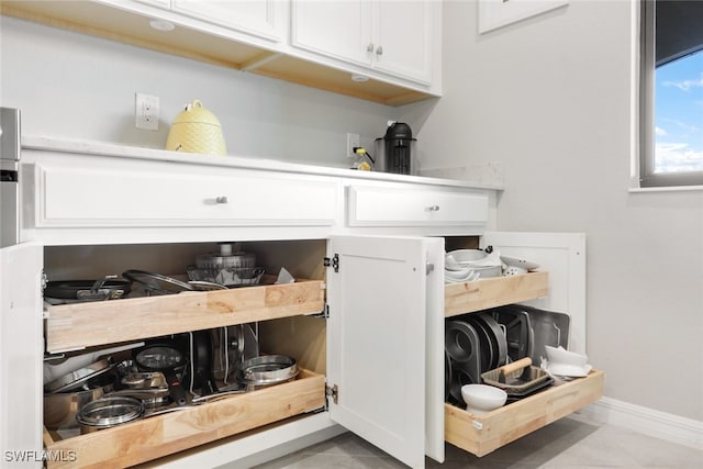 interior details featuring white cabinets