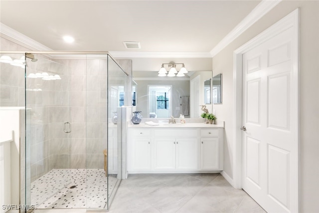 bathroom with tile patterned floors, a shower with door, ornamental molding, and vanity